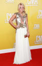 <p class="MsoNormal">Carrie Underwood <span><span>– </span>who served as the evening’s co-host along with Brad Paisley – donned a plunging dress adorned with strategically place floral appliqués that allowed her to show a little skin. A sideswept pony, dramatic eye makeup, and bright smile topped off her lovely ensemble. (11/1/2012)</span></p>