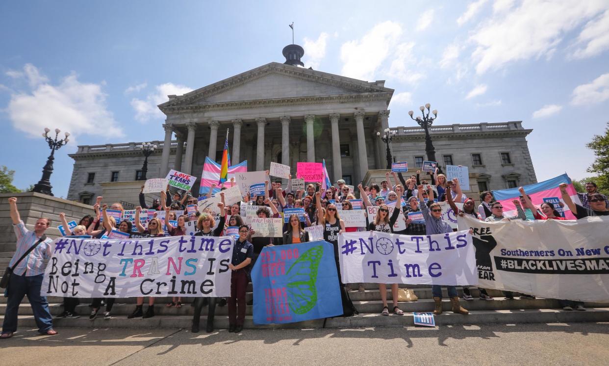 <span>The Trans Student Alliance at the University of South Carolina protests an anti-trans bathroom bill on 13 April 2016.</span><span>Photograph: Tim Dominick/AP</span>