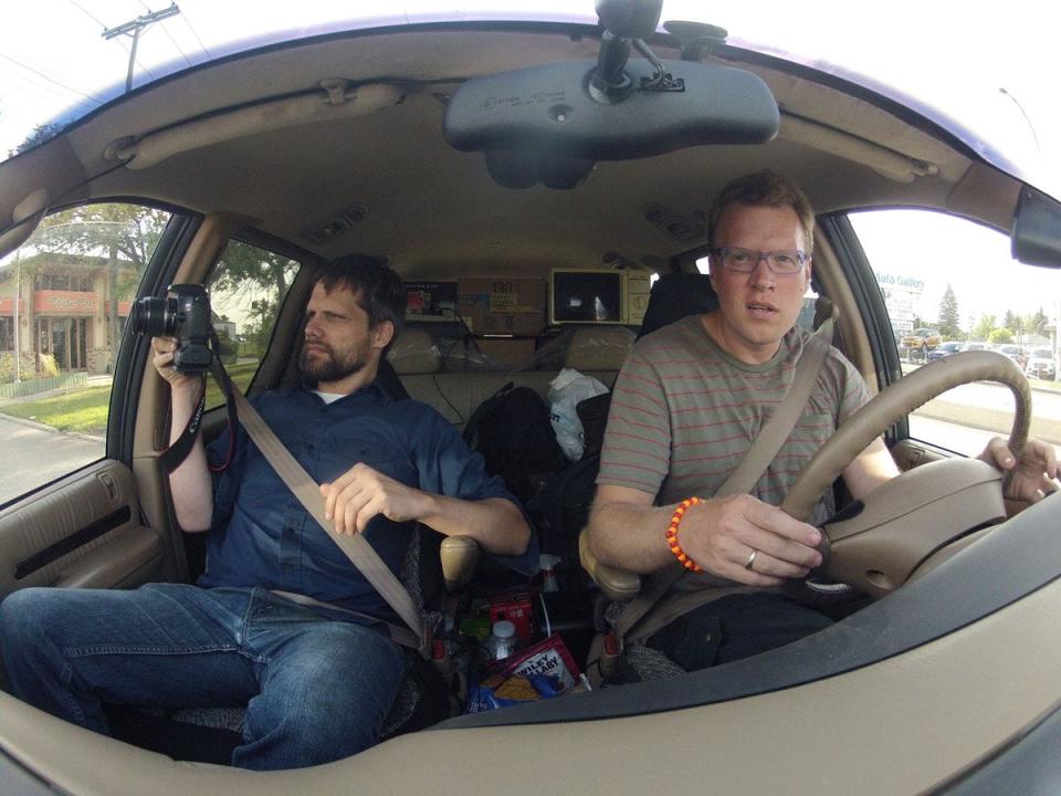 Glenn Wienke (left) and Nick Pisca (right) drive through Winnipeg, Canada, in 2919, in a van burning waste vegetable oil.