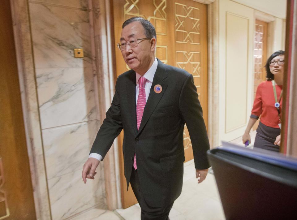 UN Secretary General Ban Ki-Moon walks out to prepare to greet U.S. Secretary of State John Kerry before the start of their meeting at Bayan Palace in Kuwait City, Kuwait, Wednesday, Jan. 15, 2014. (AP Photo/Pablo Martinez Monsivais, Pool)