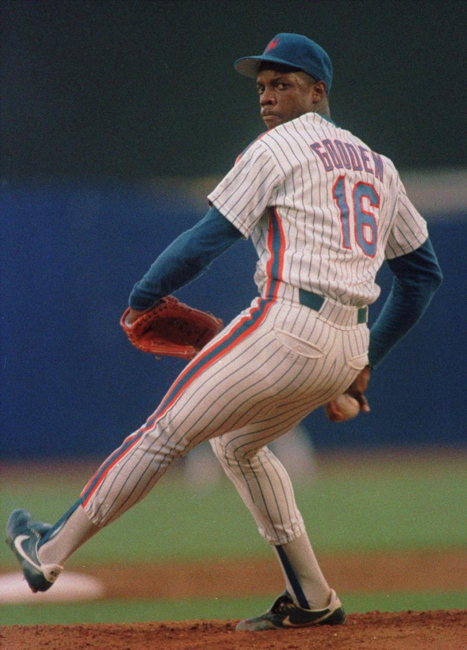 FILE--New York Mets pitcher Dwight Gooden throws his first pitch after returning from drug rehabilitation in this June 5, 1987 photo in New York. After appearing headed for greatness in his first five years in the major leagues, Gooden retired at 36, on Friday, March 30, 2001, his career hampered by injuries and drug problems.