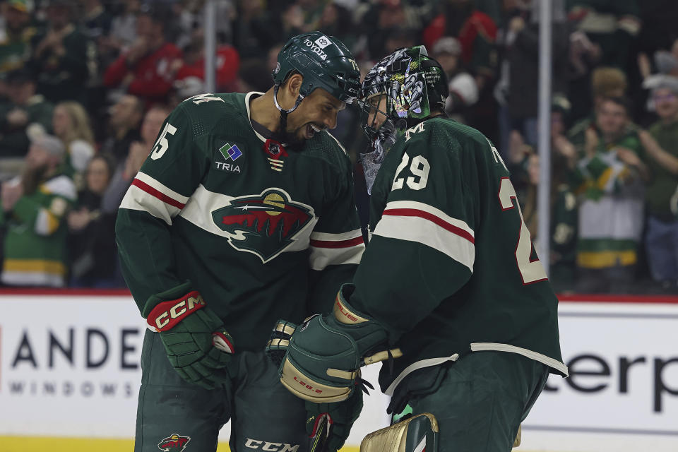 Minnesota Wild right wing Ryan Reaves celebrates with goaltender Marc-Andre Fleury after Reaves scored a goal against the Washington Capitals during the second period of an NHL hockey game Sunday, March 19, 2023, in St. Paul, Minn. (AP Photo/Stacy Bengs)