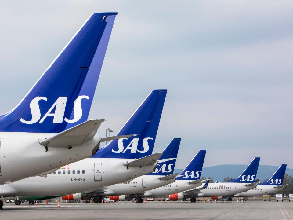 SAS planes are seen grounded at Oslo Gardermoen airport during pilots strikes, in Oslo, Friday, April 26, 2019. Pilots for Scandinavian Airlines have launched an open-ended strike following the collapse of pay negotiations, forcing the company to cancel almost all its flights. So far, 673 flights have been canceled, affecting 72,000 passengers. The Stockholm-based carrier said talks on a new collective bargaining agreement with the SAS Pilot Group, which represents 95% of the company's pilots in Sweden, Denmark and Norway, collapsed early Friday. (Ole Berg-Rusten/NTB Scanpix via AP)