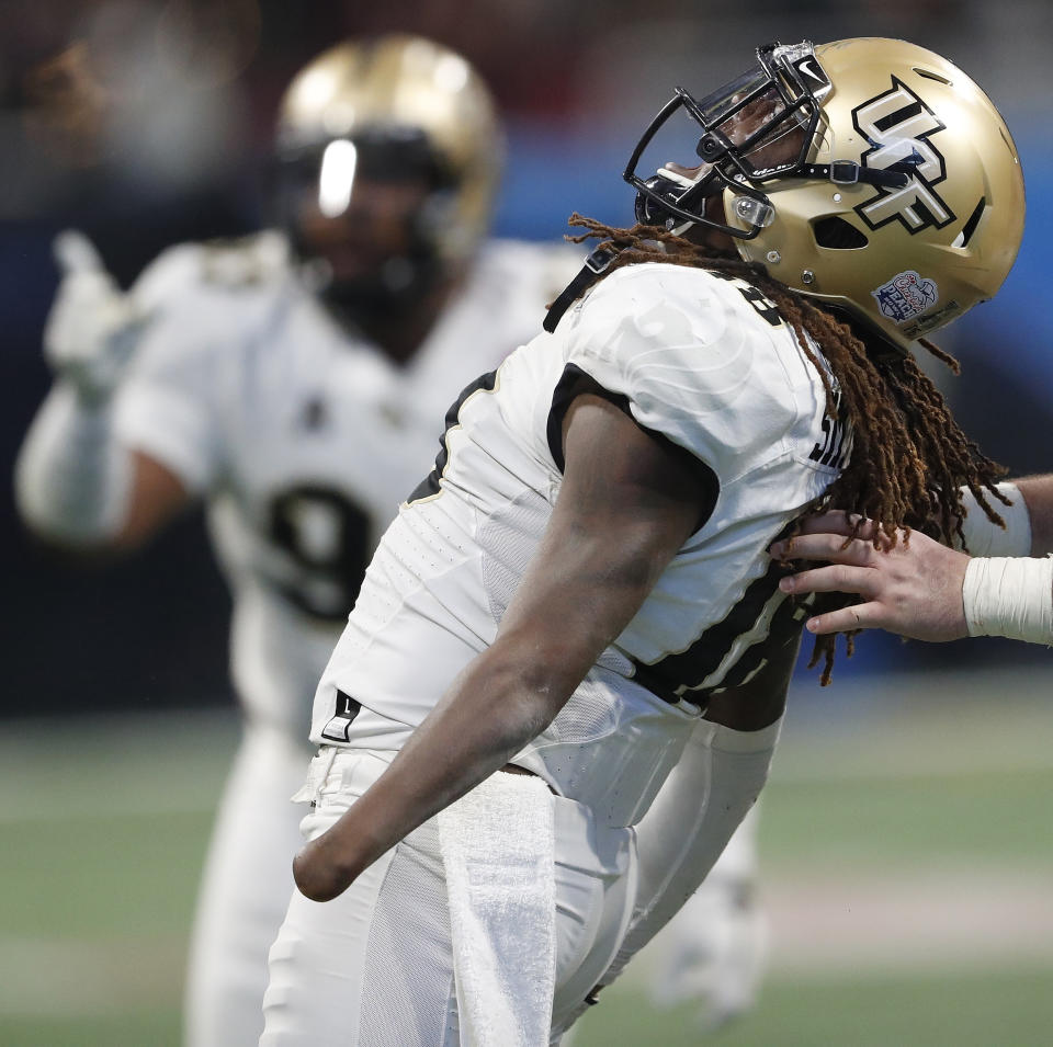 Central Florida linebacker Shaquem Griffin (18) celebrates a sack on Auburn quarterback Jarrett Stidham (8) during the second half of the Peach Bowl NCAA college football game, Monday, Jan. 1, 2018, in Atlanta. (AP)