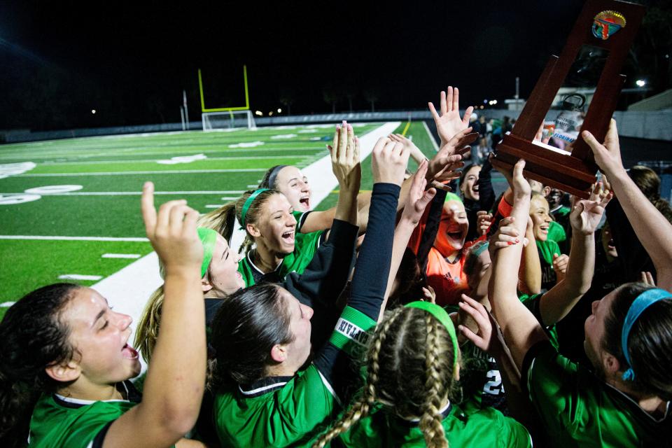 Members of the Fort Myers High School girls soccer team celebrate a win over Palmetto Ridge during the District 6A-12 Girls Soccer Championship at Fort Myers onTuesday, Jan. 30, 2024. Fort Myers won 4-0.