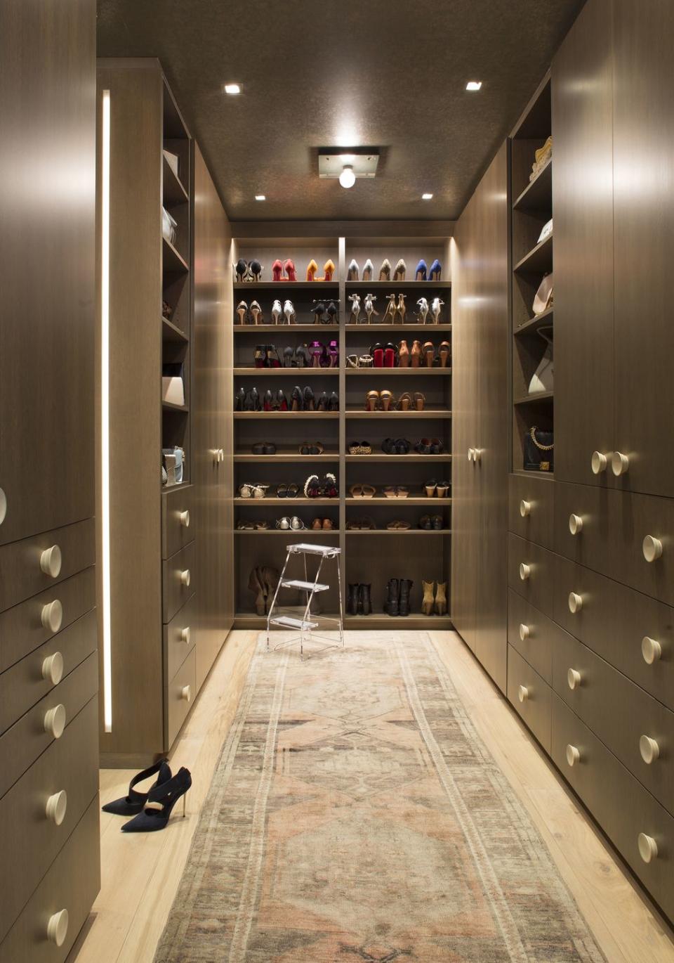 A master Closet with floor-to-ceiling shoe storage