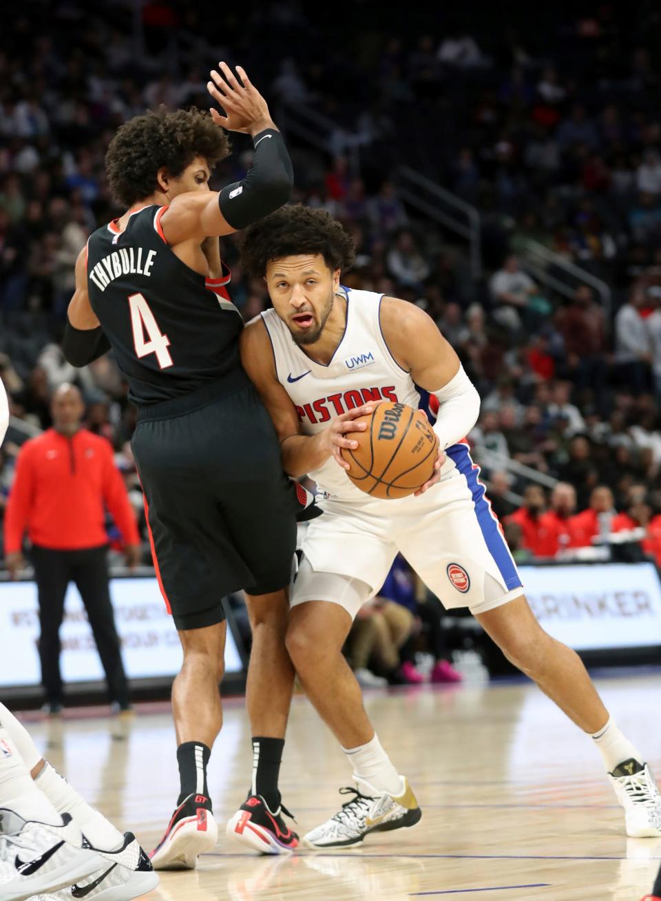 Detroit Pistons guard Cade Cunningham (2) drives against Portland Trail Blazers guard Matisse Thybulle (4) during first-quarter action at Little Caesars Arena in Detroit on Wednesday, Nov. 1, 2023.