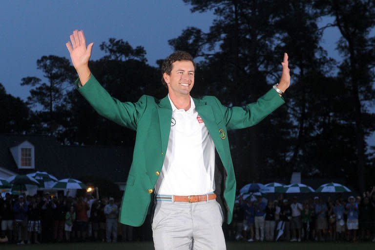 Adam Scott of Australia smiles after being presented with the Green Jacket during the Green Jacket Ceremony at 77th Masters golf tournament at Augusta National Golf Club on April 14, 2013 in Augusta, Georgia