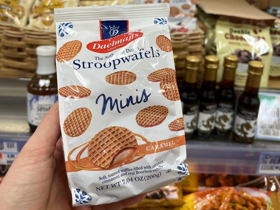 hand holding up a package of mini stroopwafels at trader joes