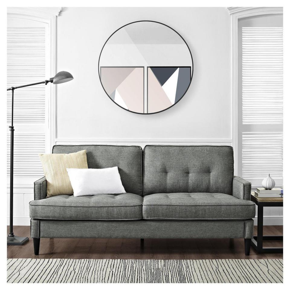 Bring depth to your home without taking up too much room with the <a href="https://www.target.com/p/marley-mid-century-modern-sofa-gray-dorel-living-174/-/A-52611794#lnk=newtab" target="_blank">Marley mid century sofa from Target</a>.