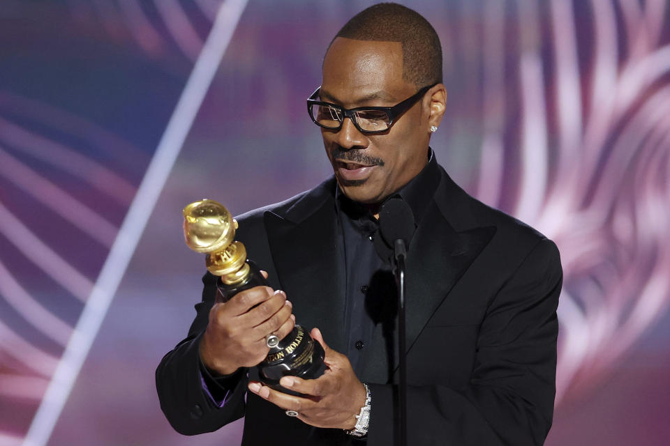 This image released by NBC shows Eddie Murphy accepting the Cecil B. DeMille Award during the 80th Annual Golden Globe Awards at the Beverly Hilton Hotel on Tuesday, Jan. 10, 2023, in Beverly Hills, Calif. (Rich Polk/NBC via AP)