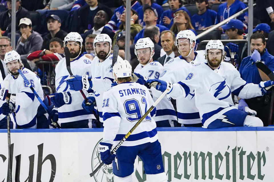 Tampa Bay Lightning's Steven Stamkos (91) is congratulated after scoring a goal against the New York Rangers during the first period in Game 1 of the NHL hockey Stanley Cup playoffs Eastern Conference finals Wednesday, June 1, 2022, in New York. (AP Photo/Frank Franklin II)