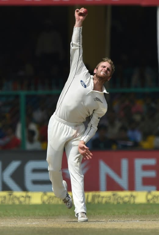 New Zealand's captain Kane Williamson bowls during the fourth day of their first Test match against India, at Green Park Stadium in Kanpur, on September 25, 2016
