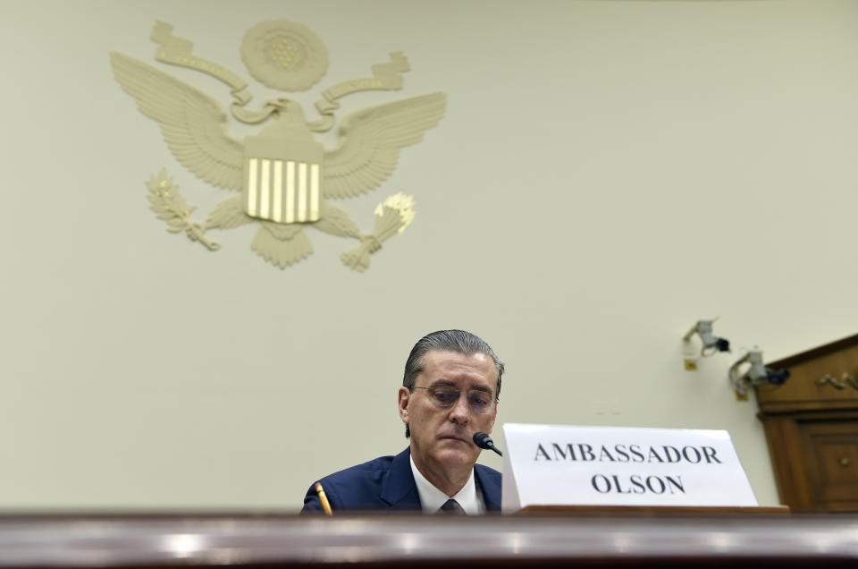 FILE - U.S. Special Representative for Afghanistan and Pakistan Richard Olson prepares to testify on Capitol Hill in Washington, Wednesday, Dec. 16, 2015, before the House Foreign Affairs Committee hearing. Olson was sentenced to three years of probation and ordered to pay a $93,350 fine Friday, Sept. 15, 2023, for improperly helping a wealthy Persian Gulf country influence U.S. policy and not disclosing gifts he received from a disgraced political fundraiser. (AP Photo/Susan Walsh, File)