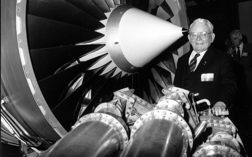 Sir Frank Whittle, inventor of the jet engine, with a Rolls-Royce RB211 engine - PA