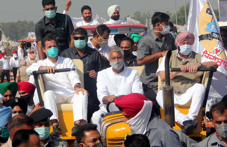 BATHINDA, INDIA  OCTOBER 4: Former Congress President Rahul Gandhi (l), CM of Punjab Captain Amarinder Singh (r) and PPCC President Sunil Jakhad (c) arrive at Congress's Kisaan Bachao Rally, at Badhni Kalan, in Moga, on October 4, 2020 in Bathinda, India. Congress leader Rahul Gandhi extended support to protesting farmers of the country onSunday and said that he will fight for their rights even as the Prime Minister Narendra Modi-led government is bent on taking away bread and land from them.(Photo by Sanjeev Kumar/Hindustan Times via Getty Images)