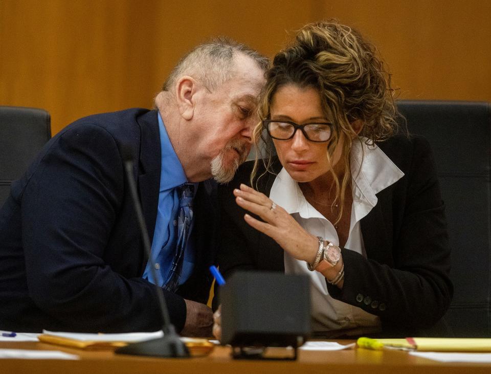 David Marshall Murdock confers with defense attorney Debra Toumey in court during jury selection on Wednesday in Bartow for his first-degree murder trial.