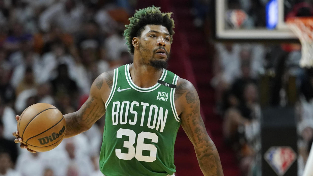 Boston Celtics guard Marcus Smart dribbles the ball during Game 2 of the Eastern Conference finals against the Miami Heat on May 19, 2022, in Miami. (AP Photo/Lynne Sladky)