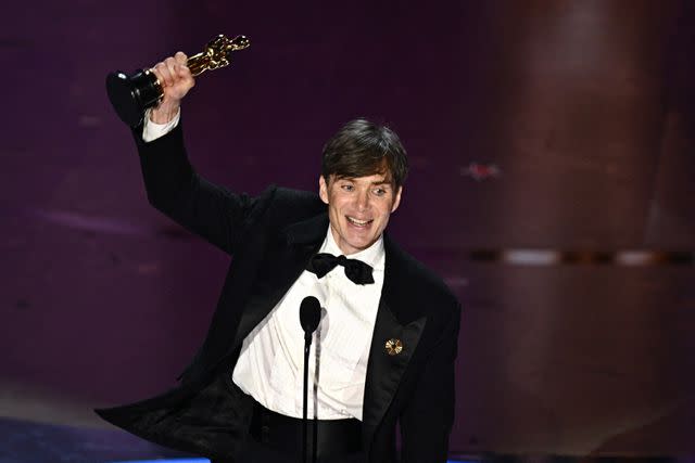 <p>PATRICK T. FALLON/AFP via Getty</p> Cillian Murphy accepting the award for Best Actor at the 2024 Oscars