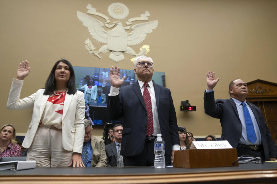 From left, Shelee Kimura, President and Chief Executive Officer of Hawaiian Electric, Mark Glick, Chief Energy Officer of the Hawaii State Energy Office, and Leodoloff Asuncion, Jr., Chairman of the Hawaii Public Utilities Commission, are sworn in as they appear before the House Committee on Energy and Commerce on Capitol Hill, Thursday, Sept. 28, 2023, in Washington. (AP Photo/Mark Schiefelbein)