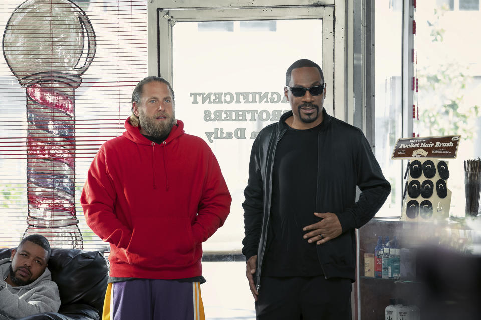 This image released by Netflix shows Eddie Murphy, right, and Jonah Hill in a scene from "You People." (Tyler Adams/Netflix via AP)