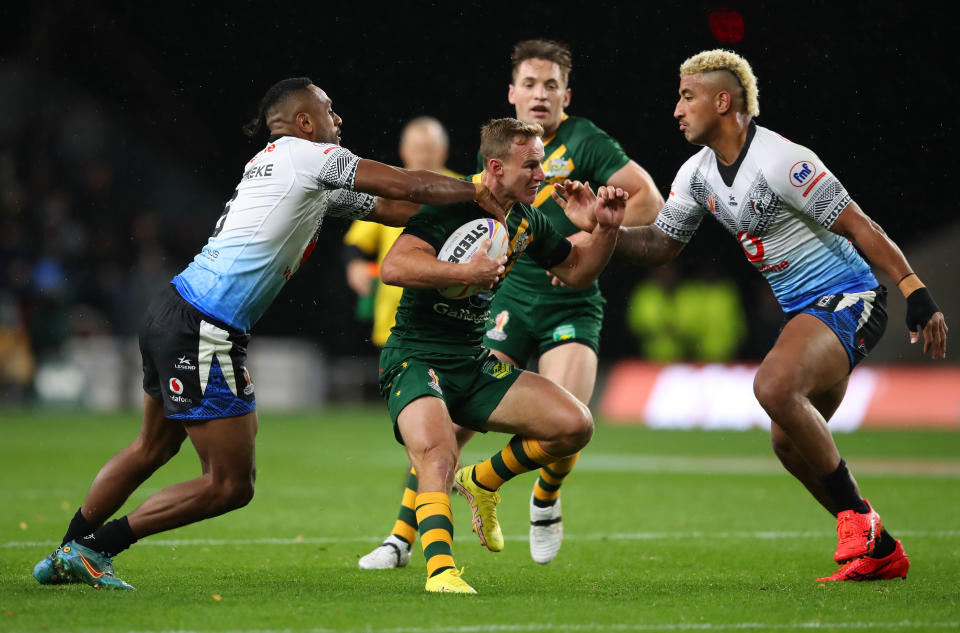 Seen here, Australia's Daly Cherry-Evans is tackled by Fijian pair Siti Moceidreke and Viliame Kikau during his side's Rugby League World Cup opener in Leeds. 