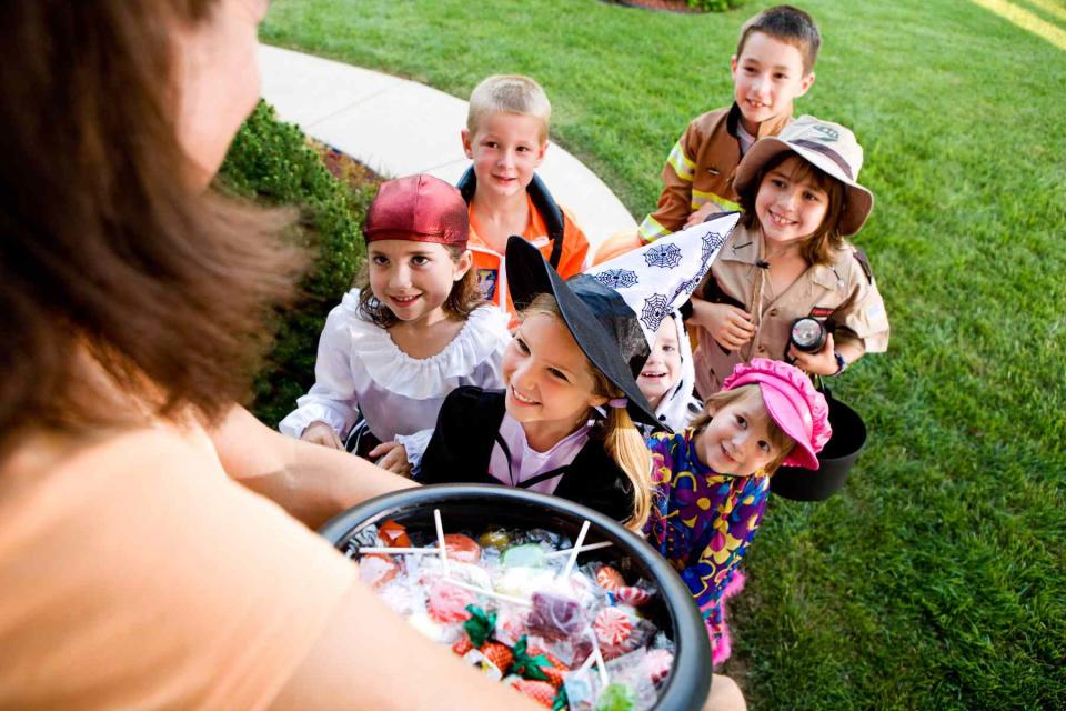 group of trick-or-treaters at door