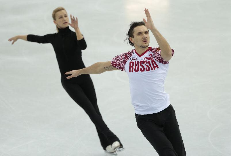 Russia's Tatiana Volosozhar and Maxim Trankov skate at the figure stating practice rink ahead of the 2014 Winter Olympics, Wednesday, Feb. 5, 2014, in Sochi, Russia. (AP Photo/Ivan Sekretarev)