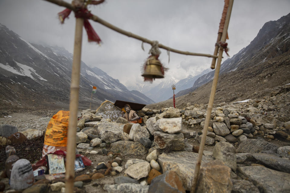 A Hindu holy man meditates near Gaumukh, a snout of the Gangotri Glacier at an altitude of 4000 meters in the northern Indian state of Uttarakhand, Saturday, May 11, 2019. Gaumukh, which literally means head of a cow, is rapidly moving backward as Gangotri Glacier has receded considerably for the last few centuries. Research has shown that Gaumukh has retreated around three kilometers in two centuries. The Gangotri glacier is one of the main sources of the River Ganges. (AP Photo/Altaf Qadri)