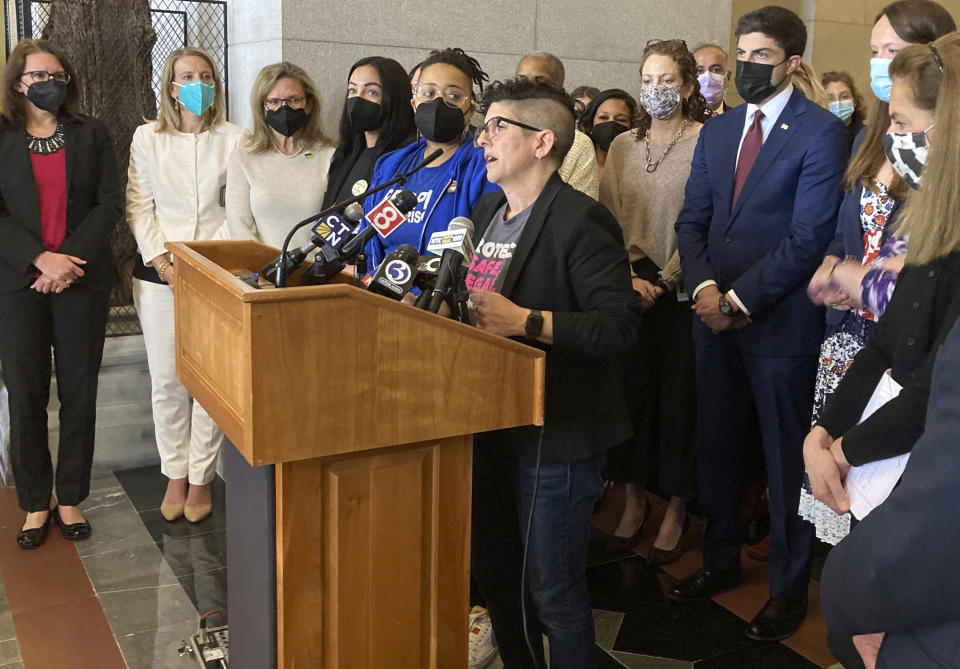 FILE - Gretchen Raffa, vice president of public policy, advocacy and organizing at Planned Parenthood of Southern New England, Inc., appears with a group of Connecticut elected officials as she speaks at a news conference, Tuesday, May 3, 2022, at the Connecticut State Capitol in Hartford. Raffa thanked lawmakers for passing legislation this session that attempts to protect providers and patients from out-of-state legal actions filed in anti-abortion states. (AP Photo/Susan Haigh, File)