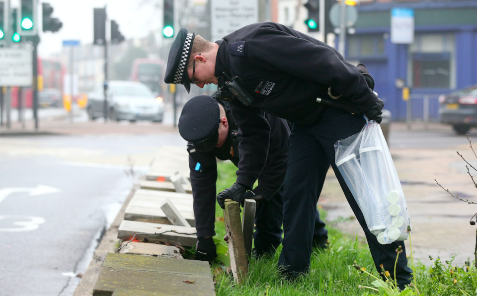 <em>Officers in Thorton Heath, south London, search for weapons (PA)</em>