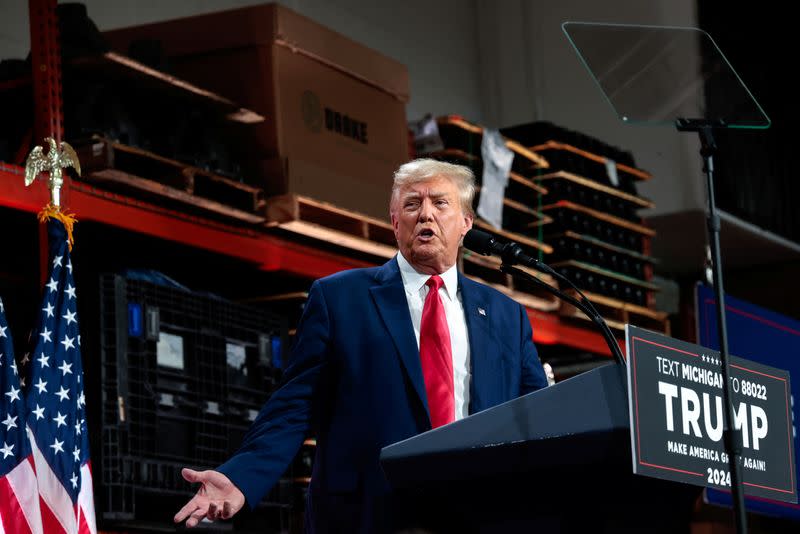 Former U.S. President and Republican presidential candidate Trump addresses auto workers as he skips the second GOP debate, in Clinton Township, Michigan