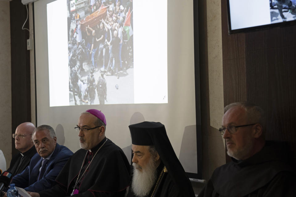 The Latin Patriarch of Jerusalem Pierbattista Pizzaballa, center, speaks during a press conference, flanked by Jamil Koussa, General Director of St. Joseph's Hospital, center left, and Greek Patriarch of Jerusalem, Theophilos III, about police violence against pallbearers at the funeral of slain Al Jazeera correspondent Shireen Abu Akleh, in east Jerusalem, Monday, May 16, 2022. After an international uproar over the funeral violence, Israeli police launched an investigation into the conduct of the officers who attacked the mourners, causing the pallbearers to nearly drop her coffin. (AP Photo/ Maya Alleruzzo)