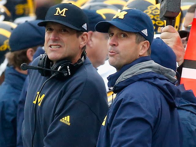 <p>Rob Carr/Getty</p> Jim Harbaugh and John Harbaugh during the first half of the Michigan and Maryland Terrapins game at Byrd Stadium on October 3, 2015 in College Park, Maryland.