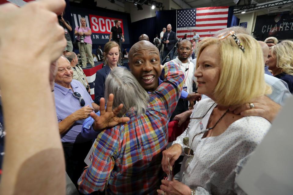 Sen. Tim Scott, R-S.C., greets and hugs supporters after announcing the launch of his presidential campaign at Buccaneer Field House on the campus of Charleston Southern University in North Charleston, S.C. on Monday.