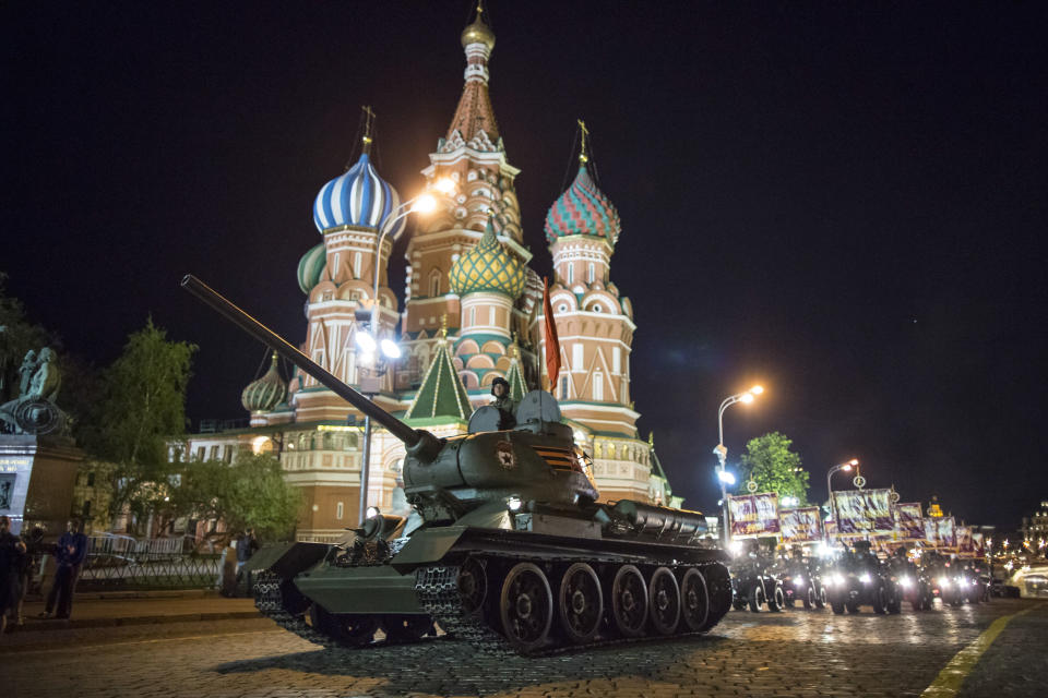 FILE - In this Thursday, May 3, 2018 filer, a World War II era Soviet tanks T-34 makes its way through the Red Square with the St. Basil's Cathedral in background, during a rehearsal for the Victory Day military parade in Moscow, Russia. The Russian Defense Ministry said Wednesday that it has received 30 T-34 tanks from Laos _ a move reflecting the national cult of the famed weapon. (AP Photo/Alexander Zemlianichenko, File)