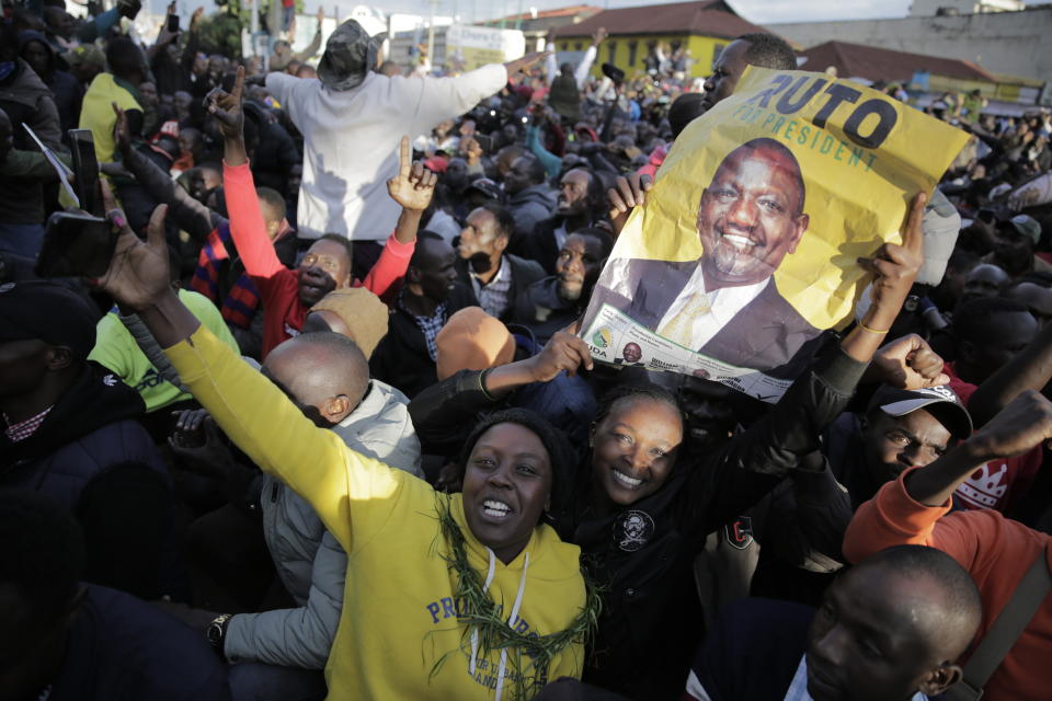 Supporters of Deputy President and presidential candidate William Ruto celebrate his victory over opposition leader Raila Odinga in Eldoret, Kenya, Monday, Aug. 15, 2022. Ruto received 50.49% of the vote, the chairman of the electoral commission said, while Odinga received 48.85%. (AP Photo/Brian Inganga)