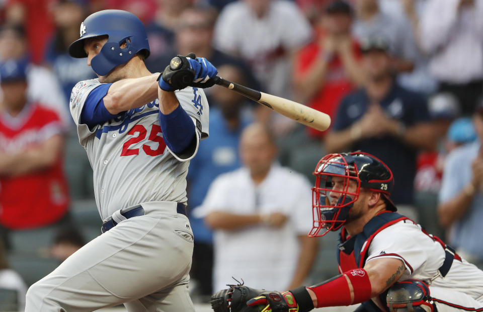 Los Angeles Dodgers' David Freese (25) hits a two-run single against the Atlanta Braves during the sixth inning in Game 4 of baseball's National League Division Series, Monday, Oct. 8, 2018, in Atlanta. (AP Photo/John Bazemore)