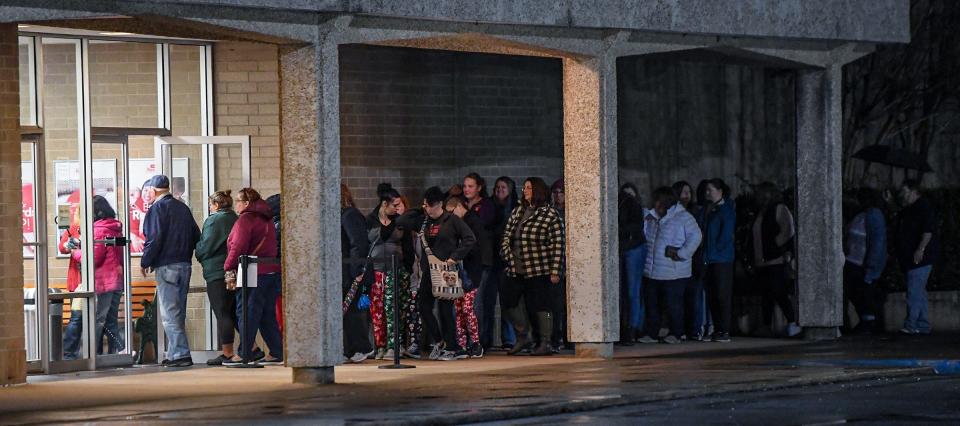 People start entering  JC Penney at their 5 a.m. opening in Anderson, S.C. Friday, November 25, 2022. In store deals and incentives still draw shoppers to come out and line up for a Black Friday deal in person, even with earlier sales and online shopping.