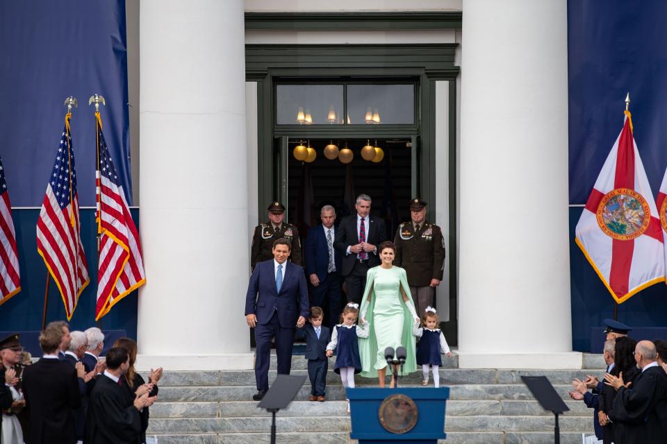 Gov. Ron DeSantis holds the hand of his son Mason, 4, as he and his family walk down the steps of the historic Capitol to attend his inauguration ceremony on Tuesday, Jan. 3, 2023. 