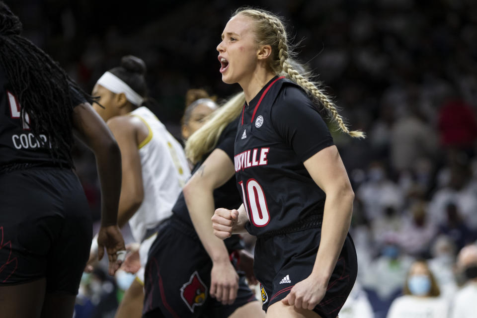 Louisville's Hailey Van Lith (10) celebrates after a basket during the first half of an NCAA college basketball game against Notre Dame on Sunday, Feb. 27, 2022, in South Bend, Ind. (AP Photo/Robert Franklin)