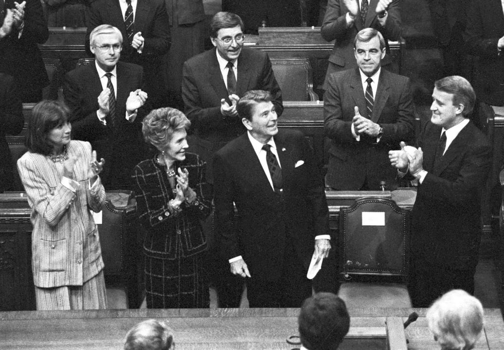 Former U.S. President Ronald Reagan is applauded by his wife Nancy, former Canadian Prime Minister Brian Mulroney and his wife Mila after addressing the Canadian Parliament in Ottawa during an official visit to Canada in this April 6, 1987.