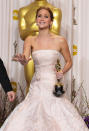 Jennifer Lawrence poses with her award for best actress in a leading role for "Silver Linings Playbook" during the Oscars at the Dolby Theatre on Sunday Feb. 24, 2013, in Los Angeles.
