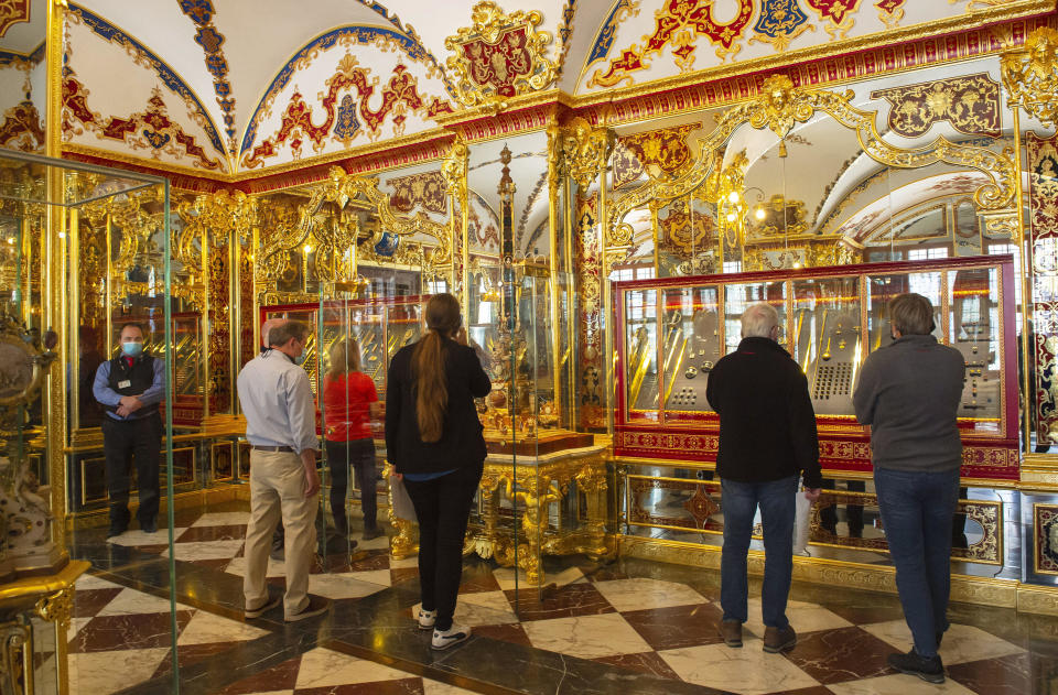 FILE - Visitors stand in the Jewel Room during the reopening of the Green Vault Museum in Dresden's Royal Palace of the Dresden State Art Collections (SKD) in Dresden, Germany, May 30, 2020.  / Credit: Jens Meyer / AP