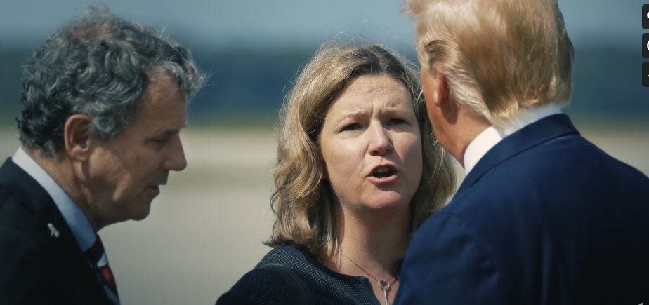 Then-Dayton Mayor Nan Whaley talks to President Donald Trump after the mass shooting in Dayton in August 2019.