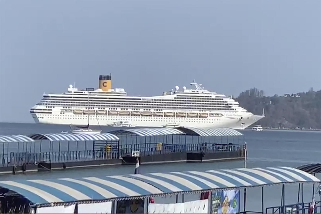 In this Friday, March 6, 2020 image taken from video, the Costa Fortuna cruise ship is seen near Phuket, Thailand. Thailand has denied entry to passengers and crew of the cruise ship that arrived at the popular Andaman Sea resort island of Phuket. (AP Photo)