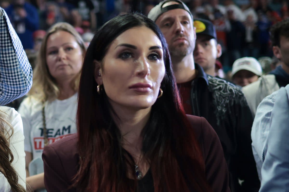 Far-right activist Laura Loomer listens as Republican presidential candidate and former President Donald Trump speaks during a Get Out The Vote rally at Coastal Carolina University on February 10, 2024 in Conway. Some Republicans are concerned about the effect she may be having on the former president (Getty Images)