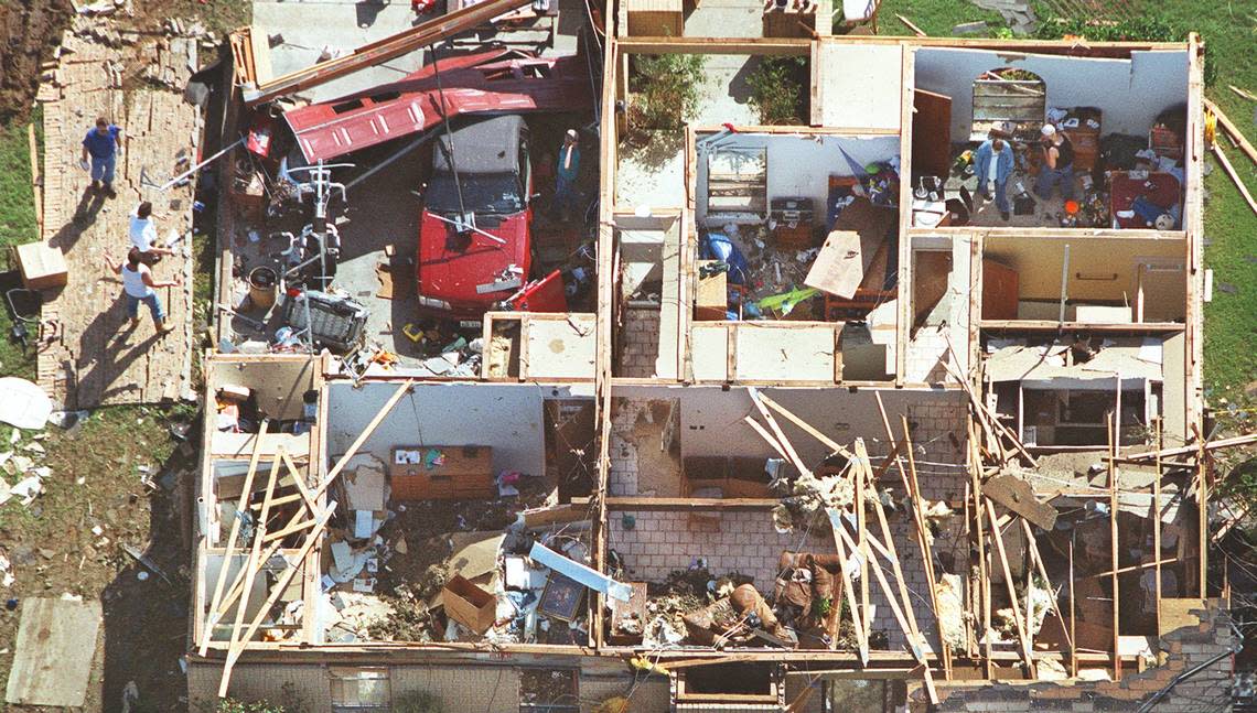 This home in Grand Prairie, on Parkside Drive, had the roof completely sucked off by a tornado on March 28, 2000.