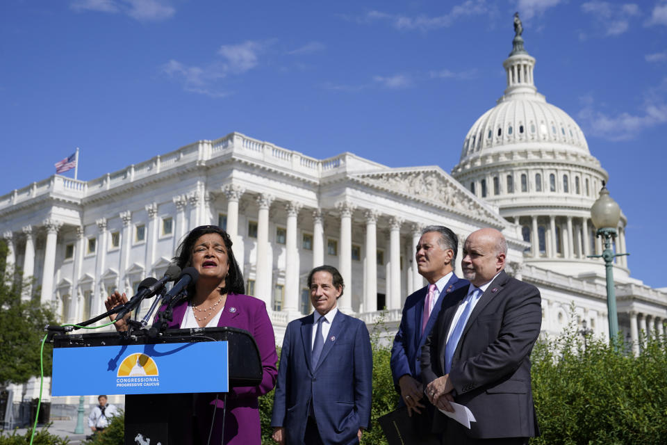 Rep. Pramila Jayapal, D-Wash., speaks at a Congressional Progressive Caucus news conference as the House meets to consider the Inflation Reduction Act, Friday, Aug. 12, 2022, on Capitol Hill in Washington. Standing with Jayapal from left are Rep. Jamie Raskin, D-Md., Rep. Mark Takano, D-Calif., and Rep. Mark Pocan, D-Wis. (AP Photo/Patrick Semansky)