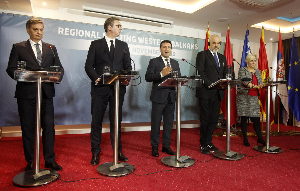 From left, Chairman of the Council of Ministers of Bosnia and Herzegovina Denis Zvizdic, Serbia's President Aleksandar Vucic, North Macedonia's Prime Minister Zoran Zaev, Albania's Prime Minister Edi Rama and Montenegro's Economy Minister Dragica Sekulic attend a joint news conference, following the Western Balkan leaders' meeting in the southwestern town of Ohrid, North Macedonia, Sunday, Nov. 10, 2019. Western Balkan leaders say they are committed to work closely and to remove administrative barriers for free movement of goods and people between their countries. (AP Photo/Boris Grdanoski)